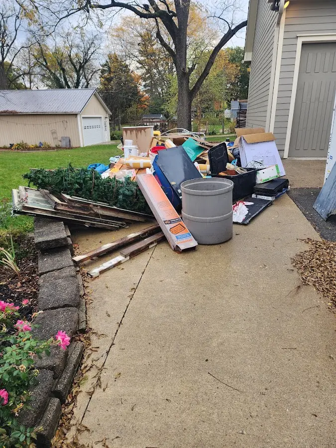 Dumpster being loaded with debris for Commercial Dumpster Rental in Cheverly